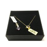 A 9ct gold garnet pendant and chain together with