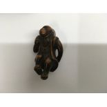 A collection of Japanese three wooden nestsuke