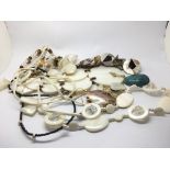 A collection of mother of pearl necklaces and earr