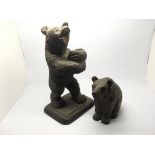 Two black forest carved bears, one in the form of