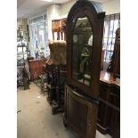 A late Victorian walnut corner cabinet with a mirr