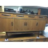 A G plan sideboard fitted with three drawers and c