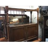 A Victorian oak and walnut buffet with turned supp