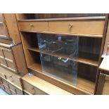 A Modern teak Nathan Bookcase with draws and slidi