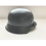 A WW2 style German M-42 Re-enactors steel helmet.