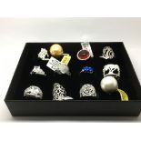 A collection of 12 silver rings, as new.