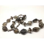 A smokey quartz and freshwater pearl necklace.