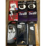 Six pairs of men's golfing gloves in retail packag