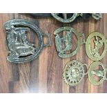 A collection of brass ware including horse brasses