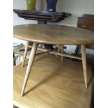 A Ercol small low occasional table with single fla