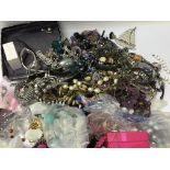 A bag containing a large quantity of dress jewelle