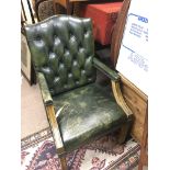 A Green leather button back office type chair open