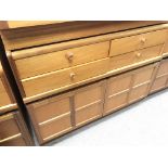 A Modern teak Nathan Cabinet with 4 draws and a cu