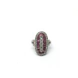 A platinum, ruby and diamond ring set with five ve