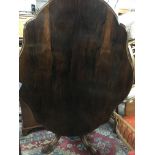 A Victorian rosewood dining table shaped Tip actio