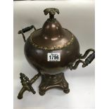 A Victorian copper and brass tea urn. 37cm.