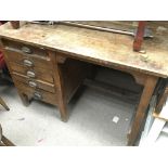 An old oak office desk the top with a hinged flap