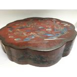 A large lacquered Chinese box decorated with a dra