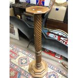 A Mahogany pedestal with spiral flutes.