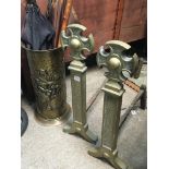 A pair of solid brass fire dogs and a brass umbrel