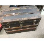 A Victorian canvas and wood bound dome top trunk w