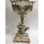 A Victorian porcelain comport with raised figures