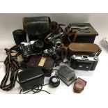 A collection of cameras and accessories including