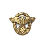 A German Military Police Officers Gilt Cap Badge.