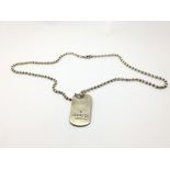 A sterling silver dog tag on chain marked 'Gucci m
