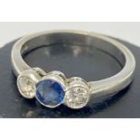 An 18ct white gold sapphire and diamond 3 stone ri