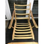 A low Ercol open arm chair with stool ( no upholst