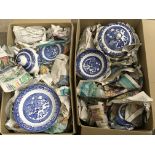 A collection of blue and woods ware willow pattern