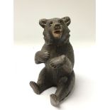A 19th century carved wood Black Forest bear with