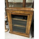 A Victorian walnut pier cabinet with a single door