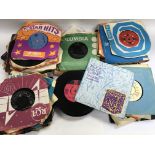 A collection of 45rpm records including Manfred Ma