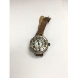 A vintage silver trench wristwatch with telephone