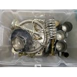 A box of various silver plated items.