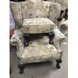 A pair of wing back chairs open armchairs in the G