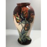 A large Moorcroft vase decorated with tulips 31cm