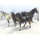 A collection of four Beswick horses comprising a m