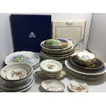 A collection of collectors plates and decorative p