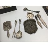 A miniature silver backed mirror silver bookmarks a purse and other oddments (a lot)