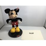 A Steiff Mickey Mouse figure on a hardwood stand w