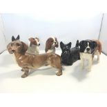 A collection of six Beswick medium size dog figure