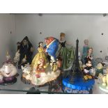 A collection of Disney licensed resin and other fi