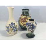 Three modern Moorcroft vases decorated with flower
