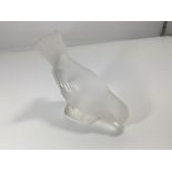 A Lalique glass bird with raised tail feathers. In