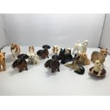 A collection of Beswick dog breed figures small si