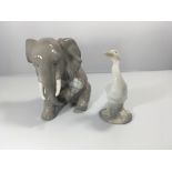A Lladro figure of an elephant with bandaged leg a