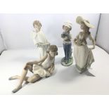 A collection of four Nao porcelain figures (one re